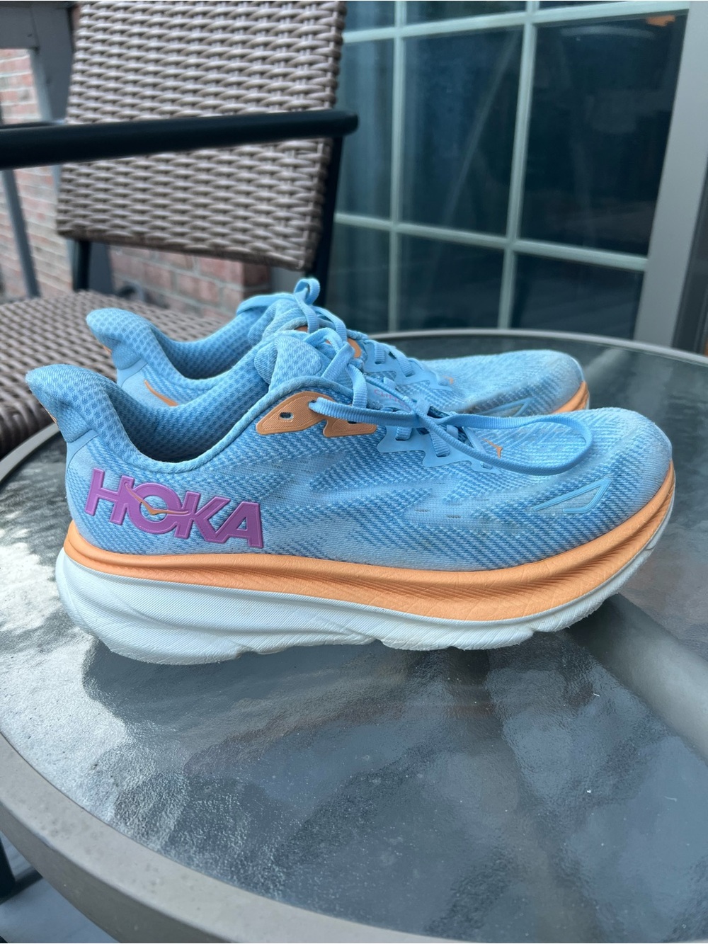 Hoka Women's Light Blue Running Shoes with Peach and Pink Accents